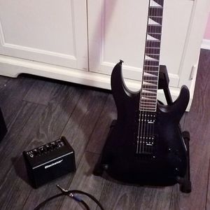 Black Jackson Dinky Electric Guitar with Mini Amp, Cord, and Guitar Stand